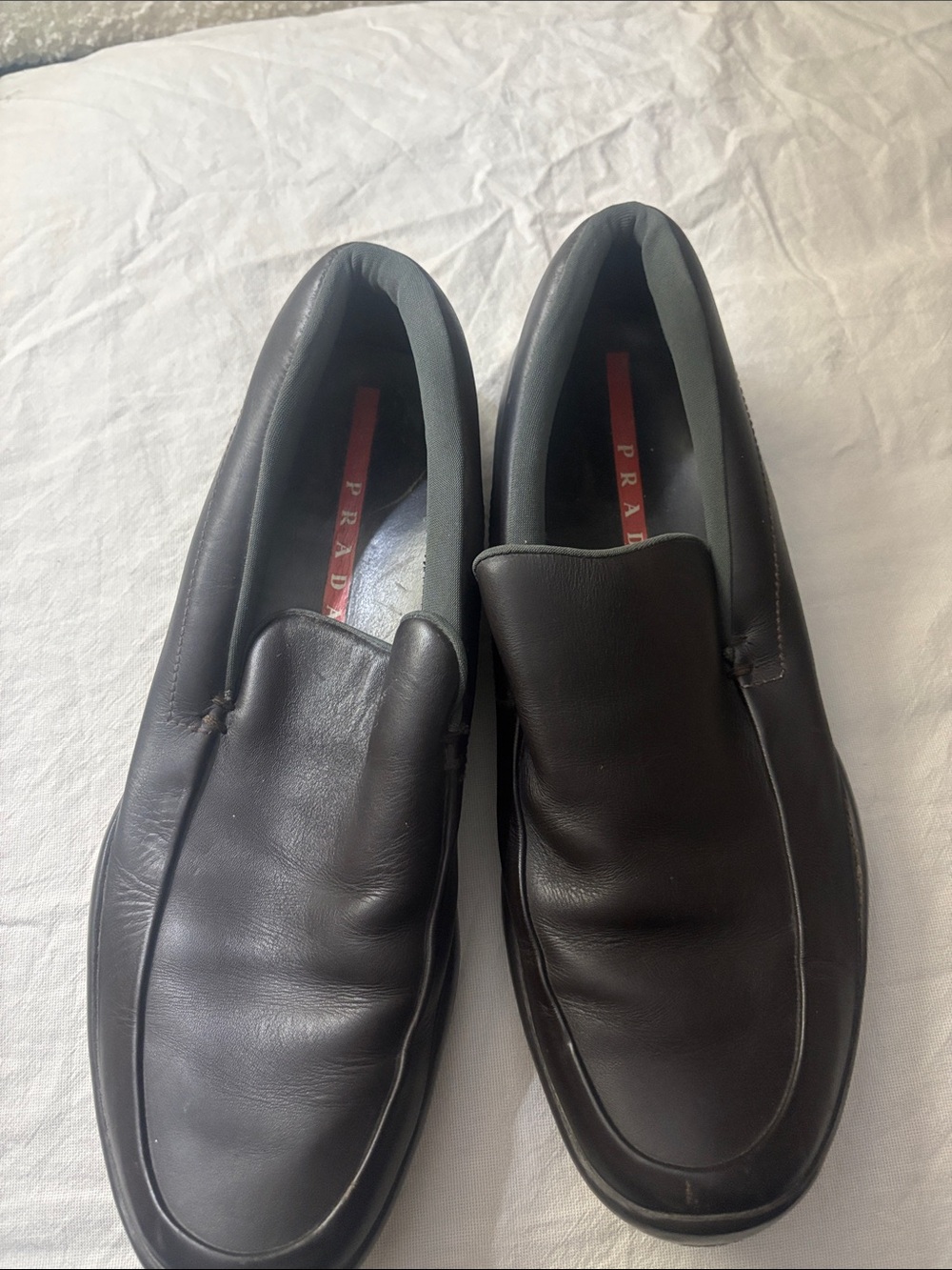 Prada Black Leather Slip-On Loafers with Red Insole Accent